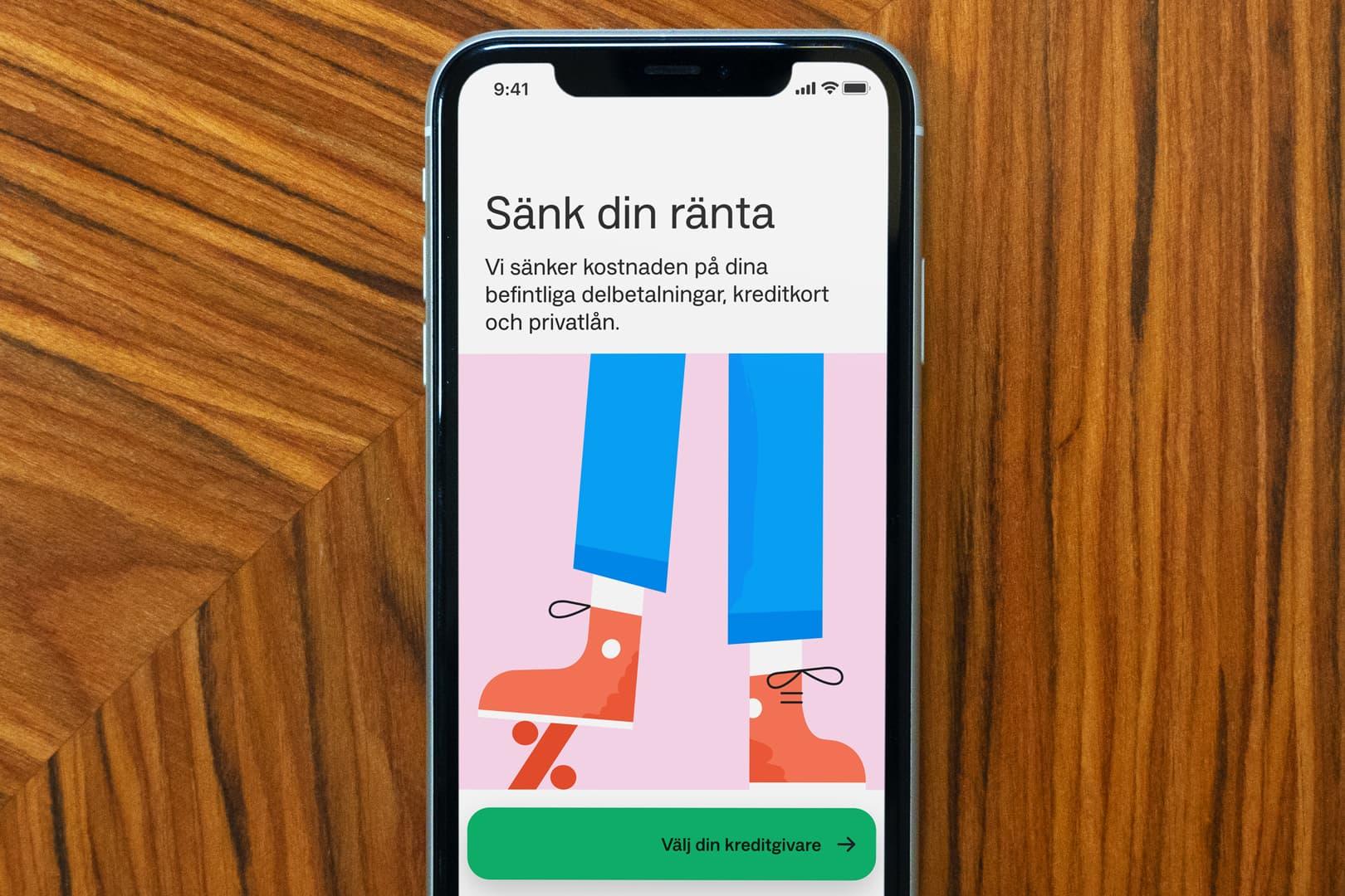 A cell phone shows an Anyfin app screen with an illustration of a foot stomping on a percentage and information on how to lower your interest rate