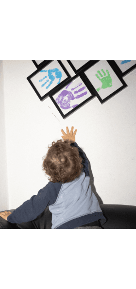 Baby with pictures of handprints